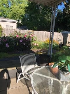 view of patio with outdoor dining area and fence