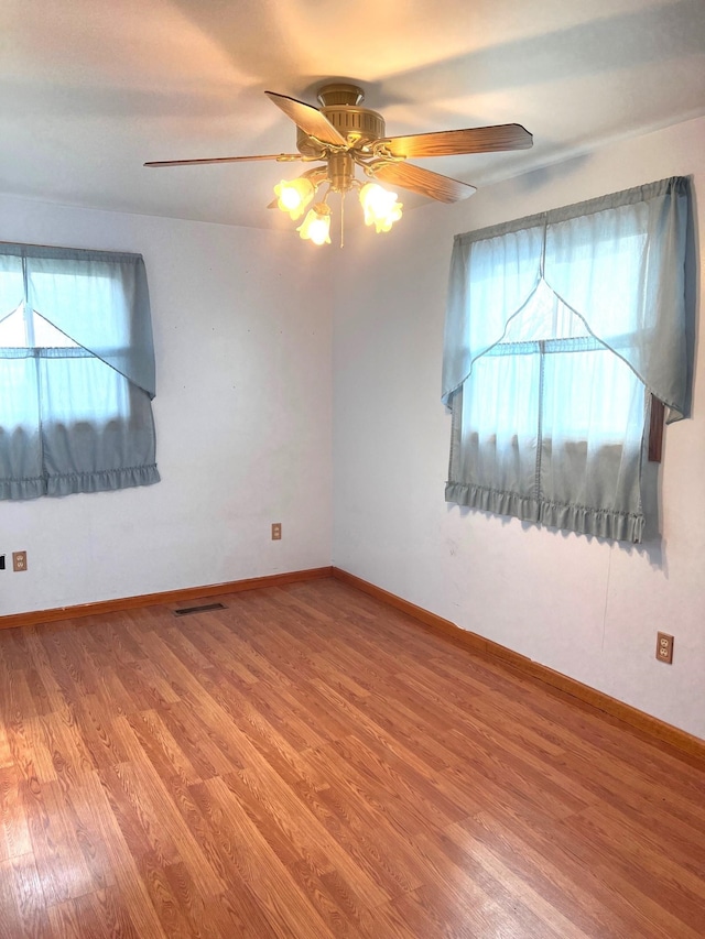 unfurnished room featuring wood-type flooring and ceiling fan