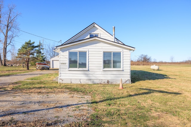 view of property exterior featuring a yard