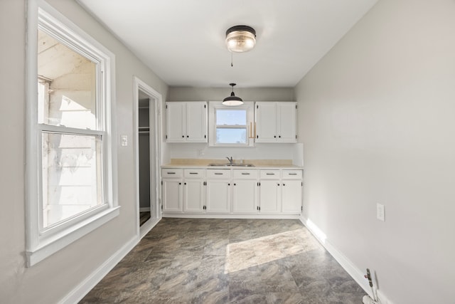 kitchen with white cabinetry and a healthy amount of sunlight