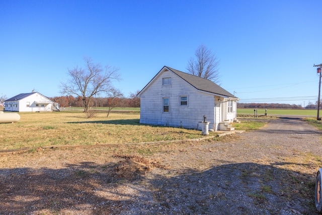 view of property exterior featuring a yard