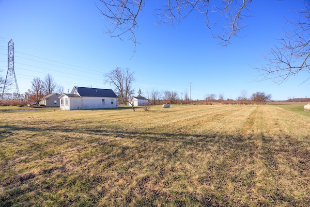 view of yard with a rural view