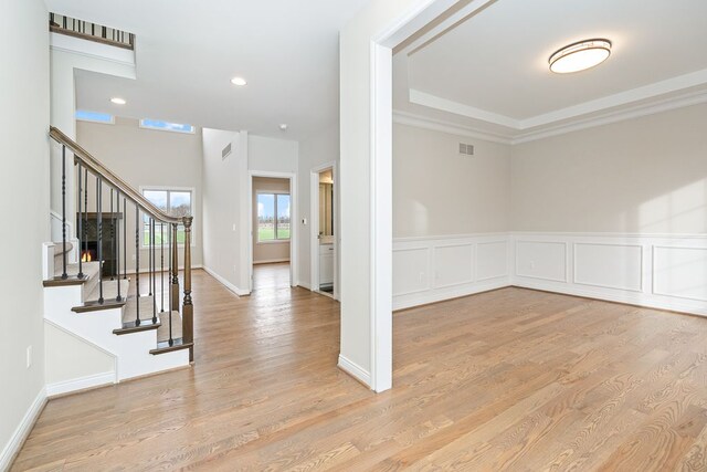 1685 E Wattles Rd, Troy, MI 48085 - unfurnished room featuring wood finished floors, stairs, ornamental molding, and recessed lighting