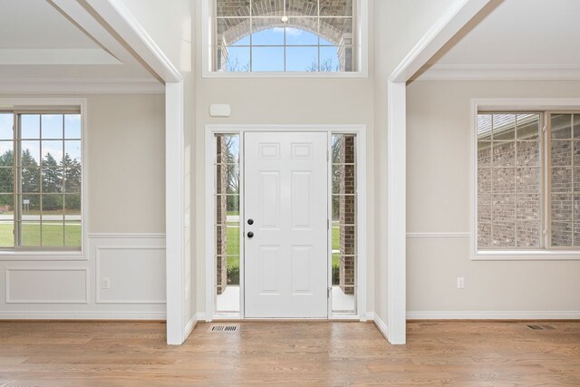 1685 E Wattles Rd, Troy, MI 48085 - entrance foyer with light wood-style flooring and crown molding