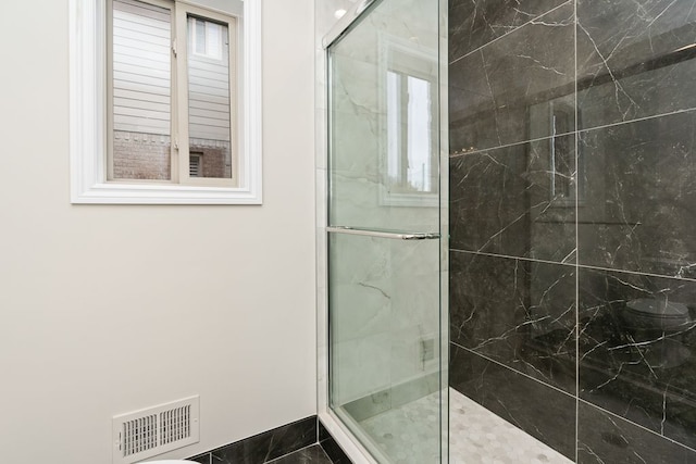 bathroom featuring an enclosed shower