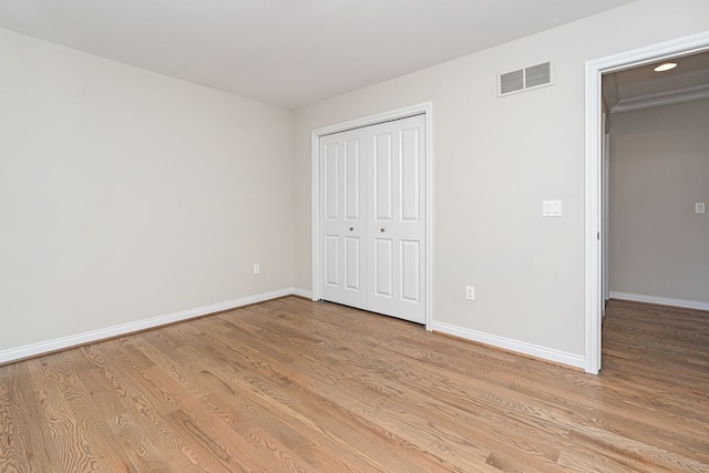 unfurnished bedroom with light hardwood / wood-style floors