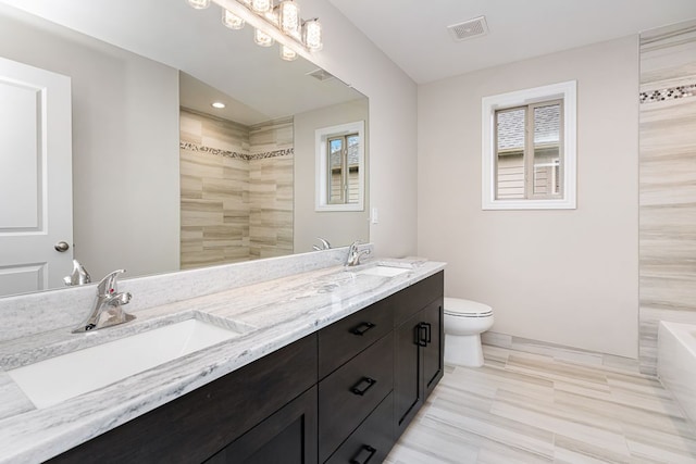 full bathroom featuring vanity, toilet, and independent shower and bath