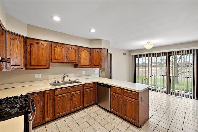 kitchen with light tile patterned flooring, kitchen peninsula, sink, and stainless steel appliances