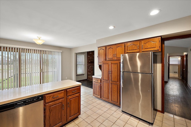 kitchen featuring light wood-type flooring and stainless steel appliances