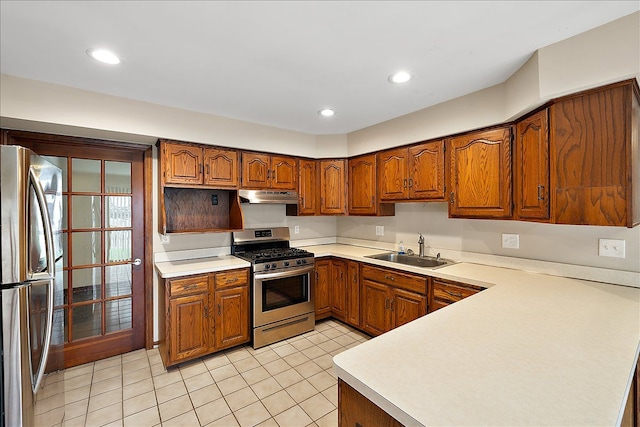 kitchen with sink, light tile patterned floors, and stainless steel appliances