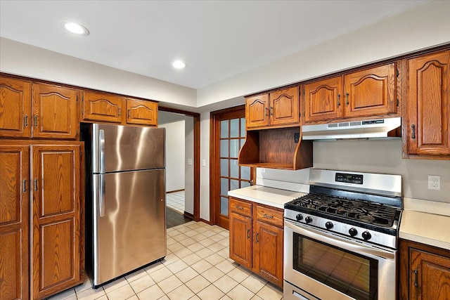 kitchen featuring light tile patterned flooring and appliances with stainless steel finishes