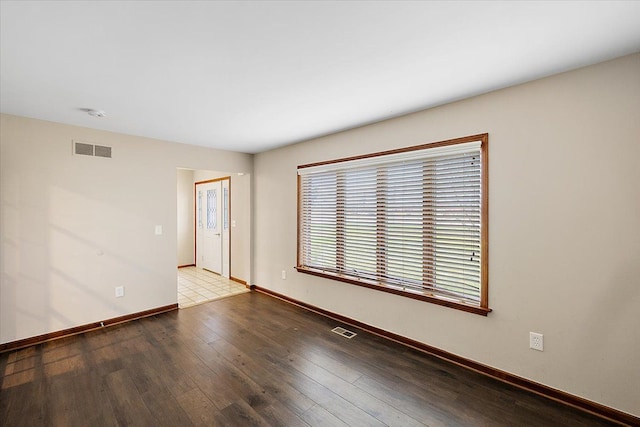 unfurnished room featuring hardwood / wood-style floors