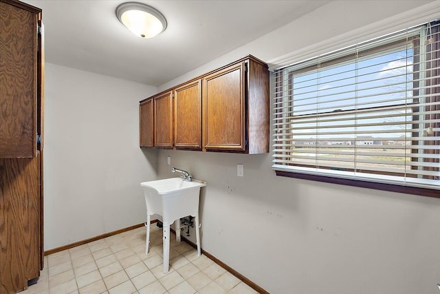 laundry room featuring light tile patterned flooring