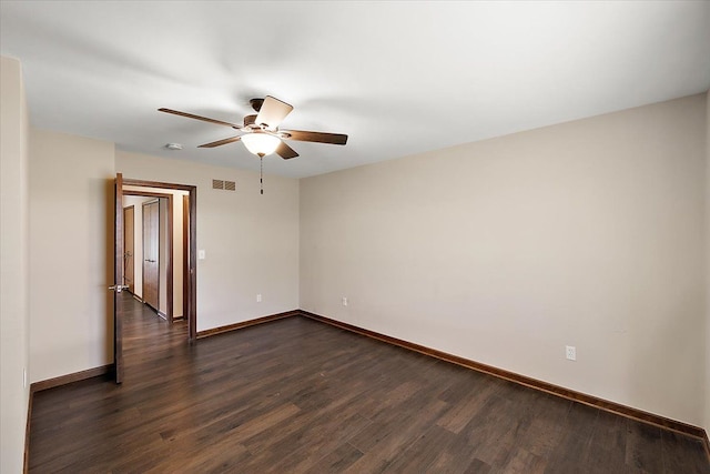 unfurnished room with ceiling fan and dark wood-type flooring