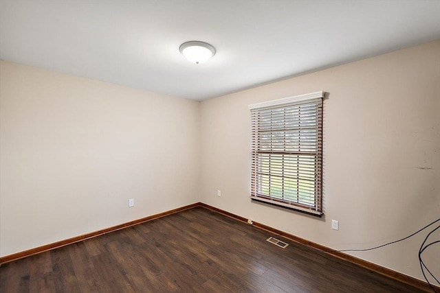 spare room featuring hardwood / wood-style floors