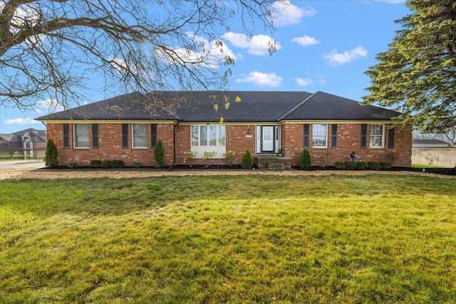 ranch-style home featuring a front lawn