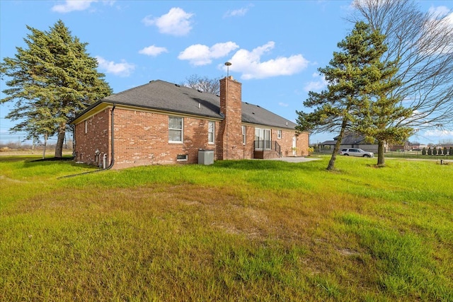 rear view of house with a lawn