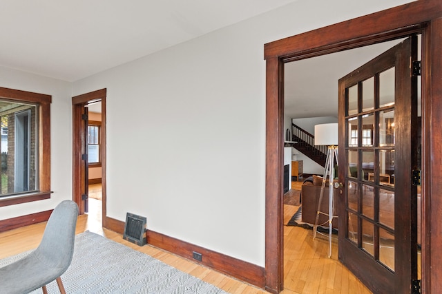 corridor featuring wood-type flooring