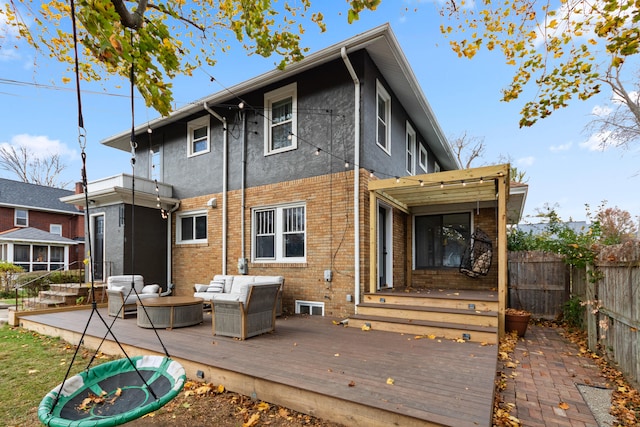 rear view of house with a deck