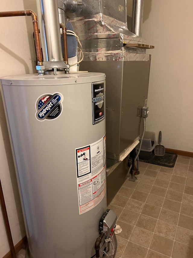 utility room featuring gas water heater