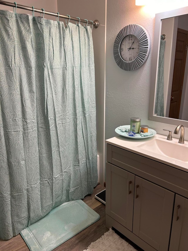 bathroom featuring vanity and hardwood / wood-style flooring