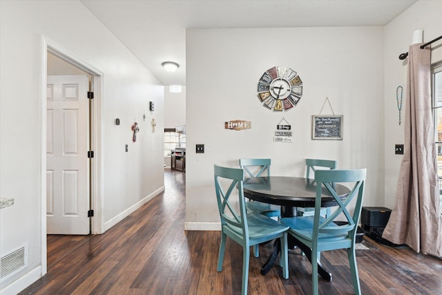 dining area featuring dark hardwood / wood-style floors