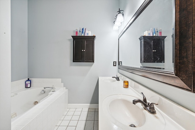 bathroom featuring tile patterned floors, vanity, and tiled tub