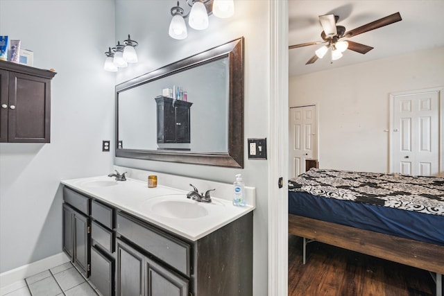 bathroom featuring tile patterned floors, vanity, and ceiling fan