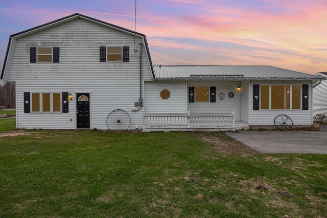 5085 W Redstone Rd, Michigan, MI 48880 - back of property featuring a yard and metal roof