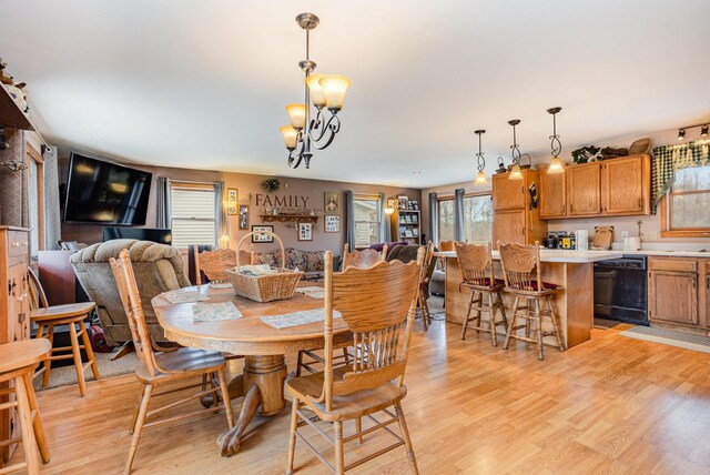 5085 W Redstone Rd, Michigan, MI 48880 - dining area with light wood-style flooring and a chandelier