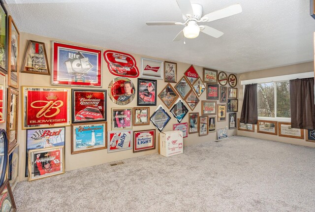 5085 W Redstone Rd, Michigan, MI 48880 - playroom featuring a textured ceiling, carpet flooring, and a ceiling fan