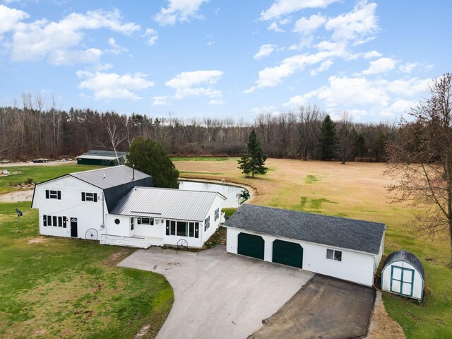 5085 W Redstone Rd, Michigan, MI 48880 - aerial view of property and surrounding area with a forest