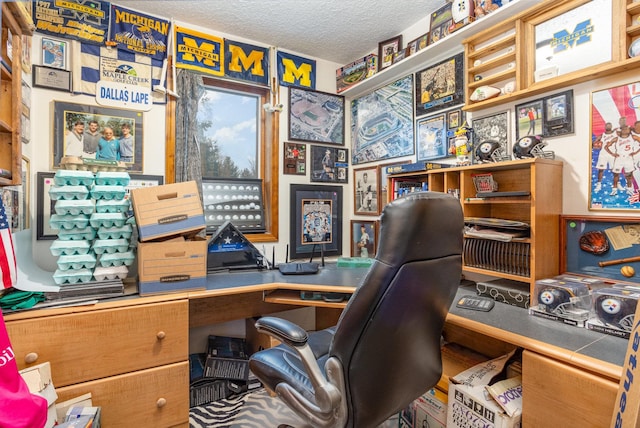 office area with a textured ceiling