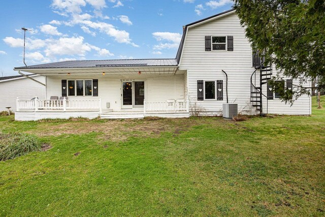 5085 W Redstone Rd, Michigan, MI 48880 - rear view of house featuring a lawn and metal roof