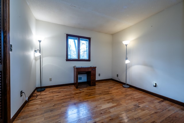 spare room featuring dark wood-type flooring