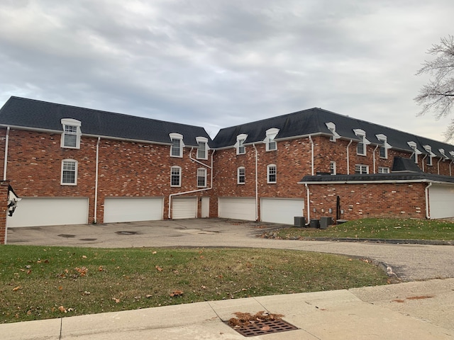 view of property exterior featuring a lawn