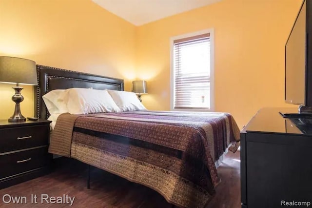 bedroom featuring dark hardwood / wood-style flooring