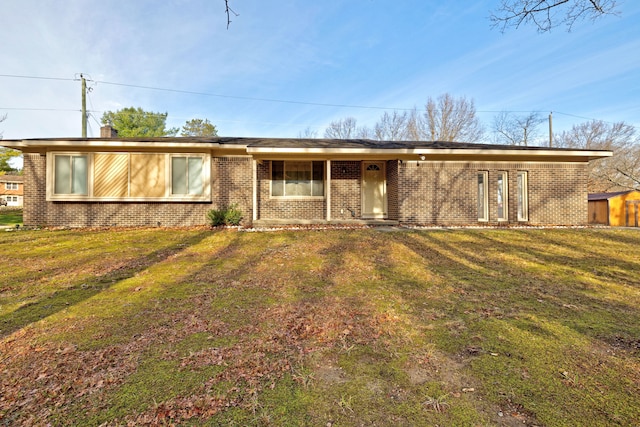 ranch-style house with a front lawn