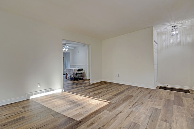 spare room featuring light hardwood / wood-style floors