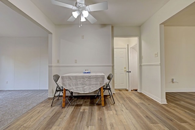 dining space featuring hardwood / wood-style flooring and ceiling fan