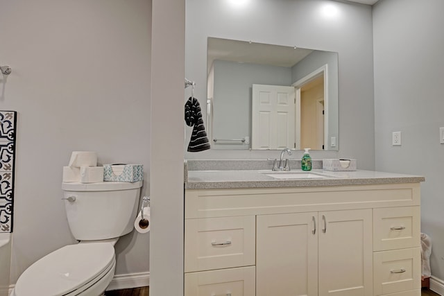 bathroom featuring vanity, toilet, and wood-type flooring