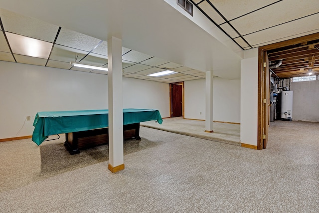 playroom featuring a paneled ceiling, carpet floors, and water heater