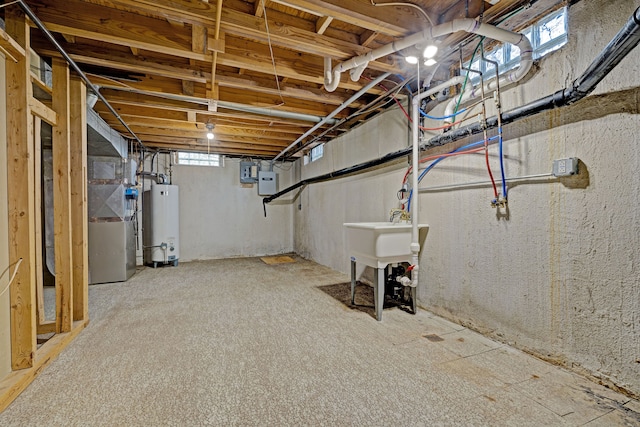 basement with gas water heater and electric panel