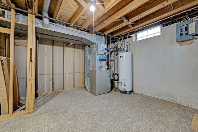 basement featuring carpet flooring, electric panel, gas water heater, and heating unit