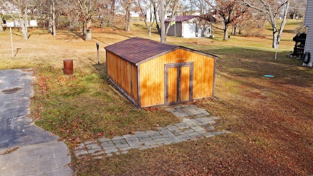 view of outbuilding with a lawn