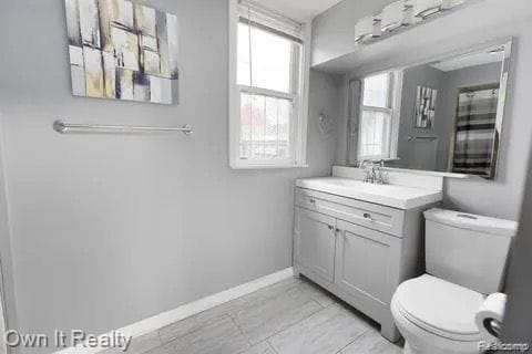 bathroom with vanity and toilet