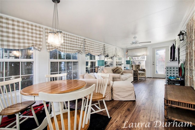 dining area featuring ceiling fan and dark hardwood / wood-style flooring