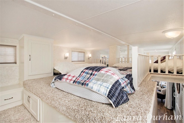 carpeted bedroom featuring a textured ceiling