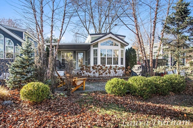 view of front facade with a sunroom