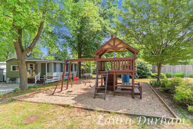 6473 Blue Star Hwy Unit 31, Saugatuck, MI 49453 - view of playground with a sunroom